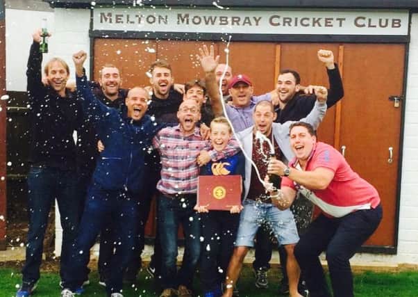 Jubilant Melton Mowbray Cricket Club players crack open the bubbly as their league title success is confirmed on Saturday afternoon EMN-160920-103029002