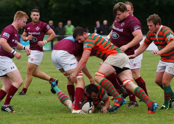 Ferocious action as Melton and Market Rasen players compete for the ball during Saturday's match PHOTO JON STAVES EMN-160919-161848002