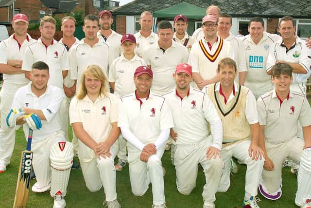 The Melton Mowbray CC and Select XI teams line up before the memorial match in tribute to former player Jon Taylor EMN-160926-104741002