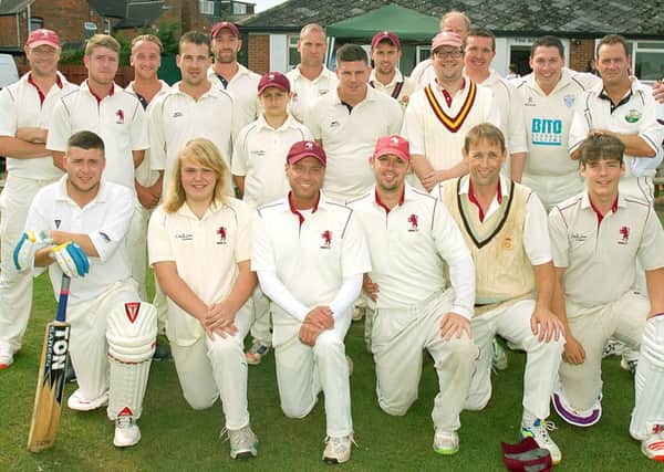 The Melton Mowbray CC and Select XI teams line up before the memorial match in tribute to former player Jon Taylor EMN-160926-104741002