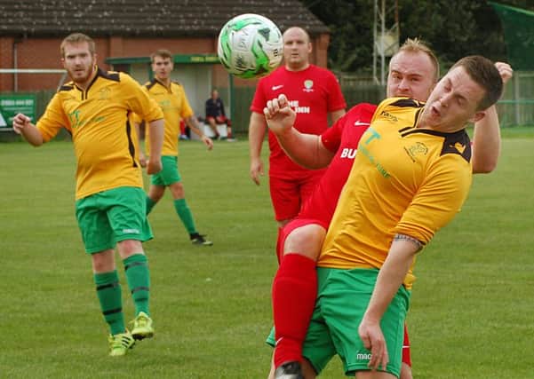 A fierce tussle for possession as the Holwell Sports Development Team take on Bottesford FC Reserves in a cup match on Saturday EMN-160926-104730002