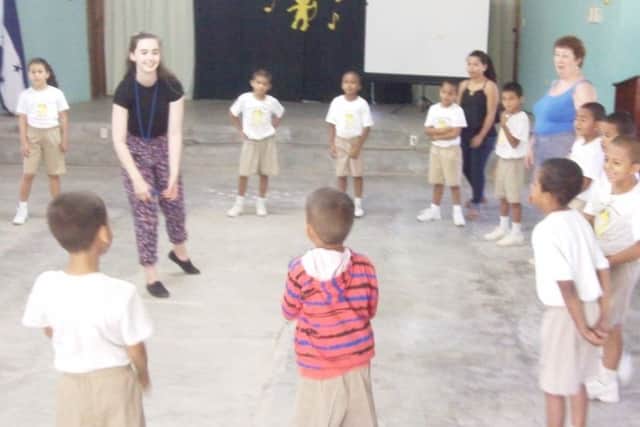 Melton Vineyard Church team members Emma Smith and Jennifer Whiteley teaching English at the boys' home through games EMN-160919-161925001