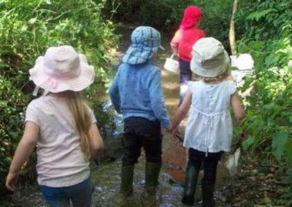 Children at Knossington and Somerby Pre-School have fun pond dipping PHOTO: Supplied