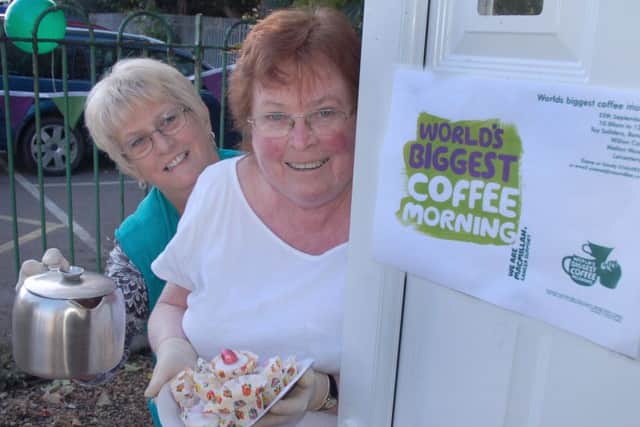 Diane Smith and Sandy Williams raising cash for Macmillan at the Tally Ho band hall PHOTO: Tim Williams