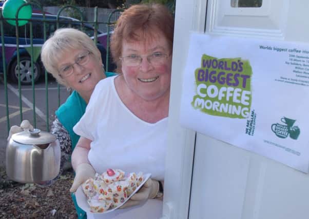 Diane Smith and Sandy Williams raising cash for Macmillan at the Tally Ho band hall 
PHOTO: Tim Williams
