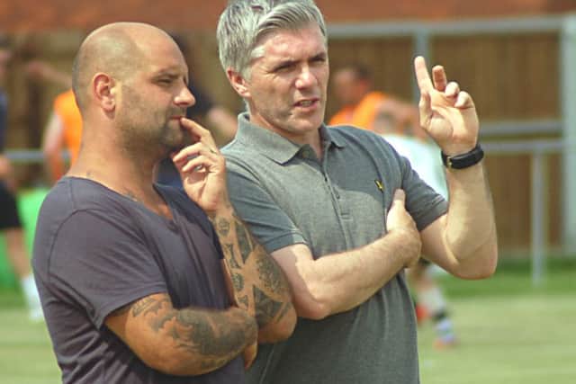 New Melton Town boss Tony Thorpe (right) mulls things over with assistant manager Ross Perkins EMN-160921-110041002