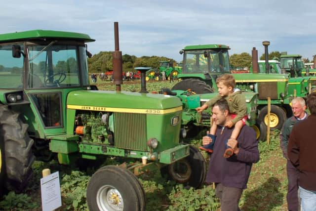 An impressive line-up of tractors from the past 100 years EMN-160925-113838001