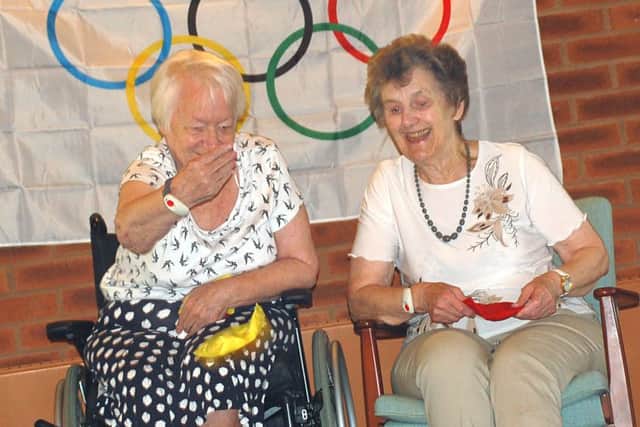 Gretton Court residents Marie Carter and Audrey Waite enjoy their bean-bag throwing challenge PHOTO: Tim Williams