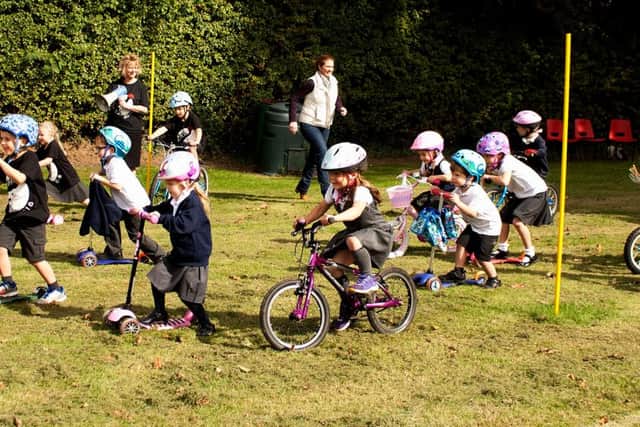 Energetic pupils put in a wheely good effort around the school field PHOTO: Supplied