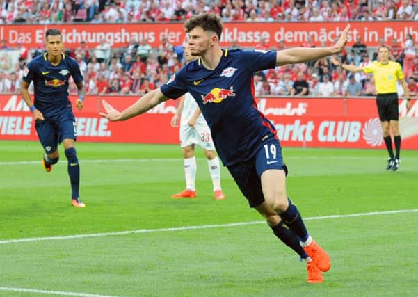 Oliver Burke celebrates scoring the opening goal on his full Bundesliga debut for Red Bull Leipzig against Cologne.
PHOTO: DPA / DPA/PA Images EMN-160927-142150002