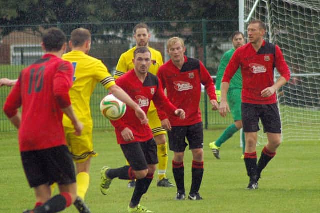Jack Baker keeps his eye on the ball against Whitworths
