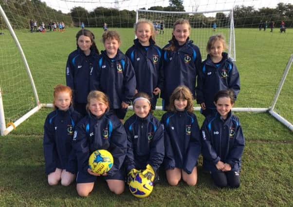 Asfordby Amateurs Girls Under 10s Gems in their new club rain jackets, provided by Melton Sports. From left, back  A. Perks, C. Plimmer (capt), I. Fletcher, E. Sutcliffe, R. Price; front  M. Tinsley, E. Curtis, M. Paterson, E. Baker, D. Ferreira De Oliveria EMN-160410-124831002