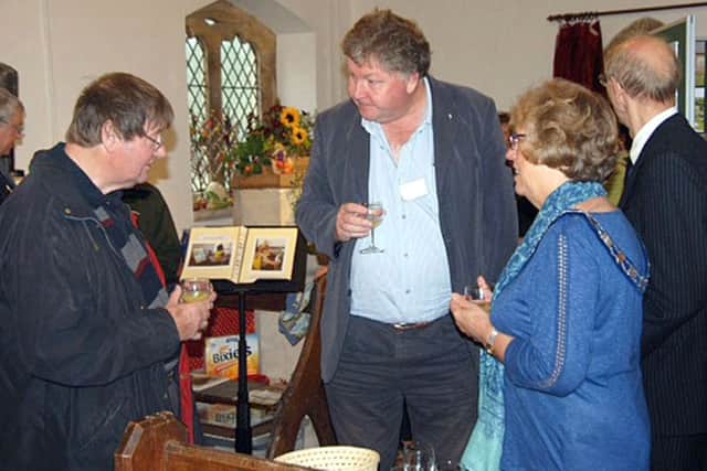 Welby Church warden Sam Willder chats with Geoff Nickolds from the Heritage Lottery Fund and Dinah Hickling from Melton Town Estate at the open day EMN-160410-105116001