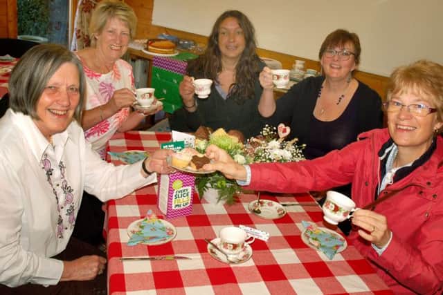 Alison Blythe (left) welcomed visitors for coffee and cake at Tresillian House. The coffee morning raised Â£100 PHOTO: Tim Williams
