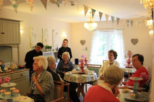 Residents and their families enjoy the new 'Memories Cafe' at Belvoir Vale Care Home at Widmerpool EMN-160410-155003001
