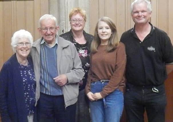 Surprise, surprise! John Sutton, second left, is pictured with members of the hand bell and tower bell ringers who recently celebrated a birthday. They are Marian Sutton, Liz Carter, Emily Richardson and tower captain William Saywell PHOTO: Supplied