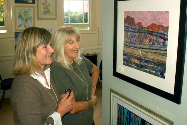Sally Edwards takes a tour round the show with one of the organisers Anne Copley PHOTO: Tim Williams