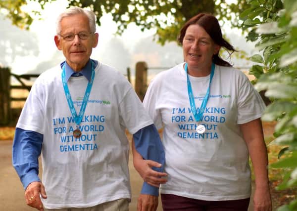 Carel Quaife (80), a resident of Scalford Court nursing home at Melton, with night time leader Suzanne Parker, who walked 8km together to raise money for dementia research EMN-161110-130235001