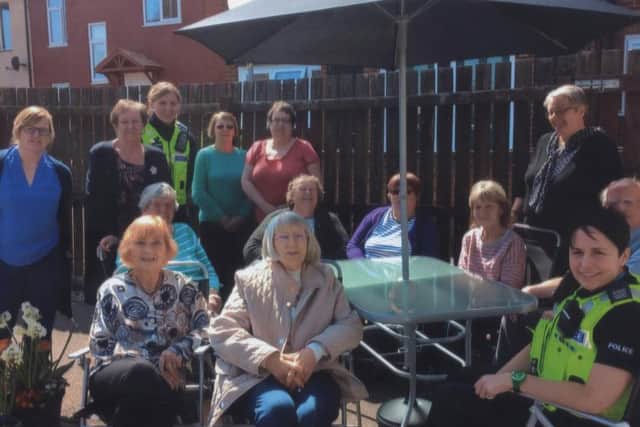 The Springfield Circle social group received £300 fro last year's Make It Happen community chest which has enabled them to buy new garden furniture and plants for their courtyard. Group founder Linda Peters is pictured second from left on the back row. EMN-160905-141447001