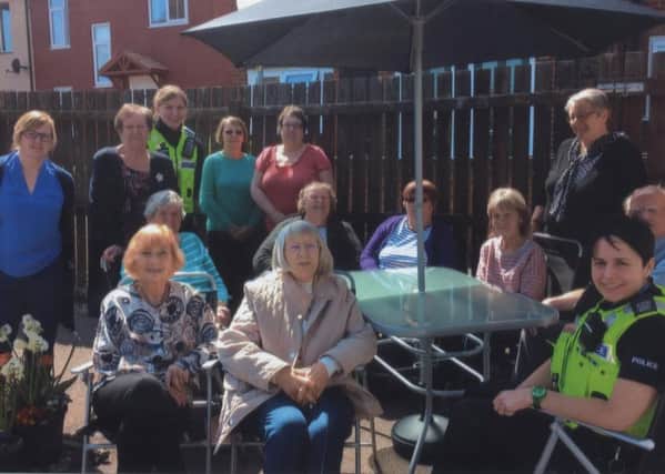The Springfield Circle social group received Â£300 fro last year's Make It Happen community chest which has enabled them to buy new garden furniture and plants for their courtyard. Group founder Linda Peters is pictured second from left on the back row. EMN-160905-141447001