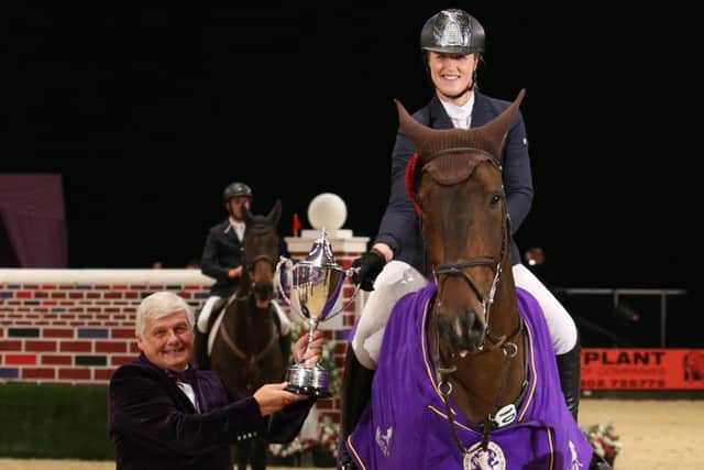 Holly Smith with her puissance champion Quality Old Joker EMN-161210-142332002