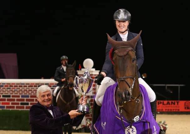 Holly Smith with her puissance champion Quality Old Joker EMN-161210-142332002