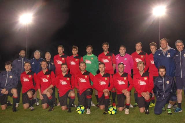 Melton Town line up before their first floodlit fixture at Digital Deadline Park EMN-161210-155613002