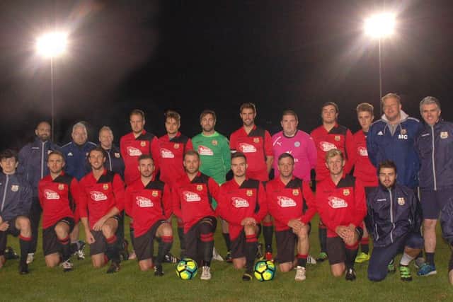 Melton Town line up before their first floodlit fixture at Digital Deadline Park