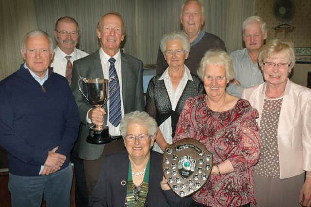 Holwell Sports Bowls Club president Anne Whittaker with the season's trophy winners. EMN-161210-172759002