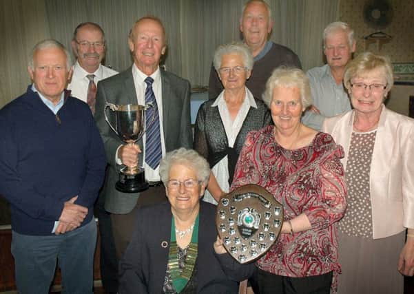 Holwell Sports Bowls Club president Anne Whittaker with the season's trophy winners. EMN-161210-172759002