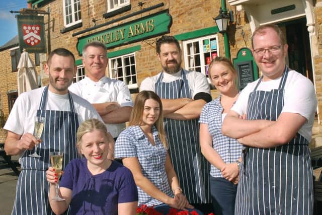 Neil and Louise Hitchen celebrate with staff at the Berkeley Arms after being awarded a coveted Bib Gourmand in the 2016 Michelin Guide EMN-161210-172211001