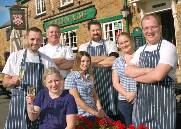 Neil and Louise Hitchen celebrate with staff at the Berkeley Arms after being awarded a coveted Bib Gourmand in the 2016 Michelin Guide EMN-161210-172211001