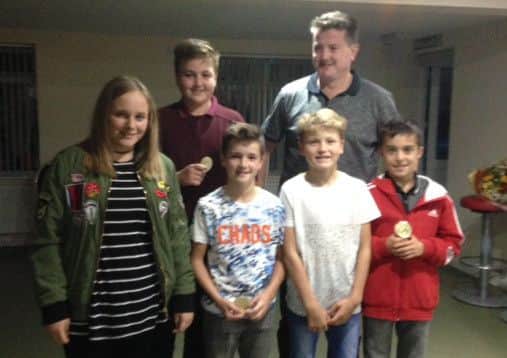 Team manager Tim Pedlar with some of the under 13s squad EMN-161014-092734002