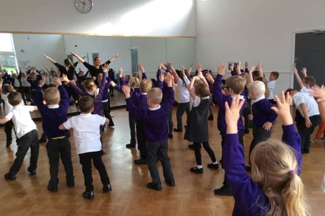 Children pull some shapes in the Bollywood dance workshops they took part in for their Diwali Day PHOTO: Supplied