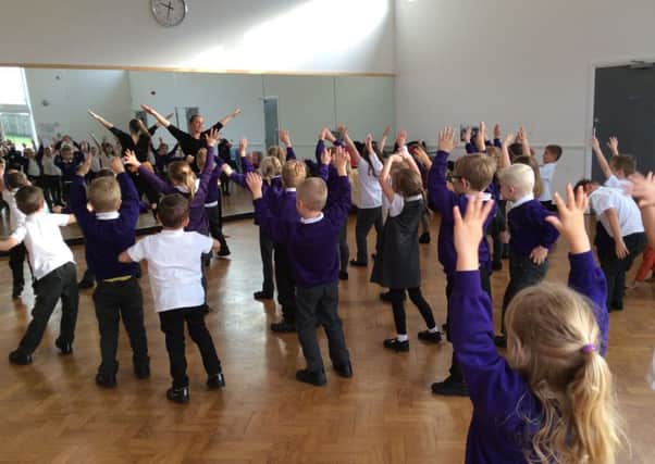 Children pull some shapes in the Bollywood dance workshops they took part in for their Diwali Day PHOTO: Supplied