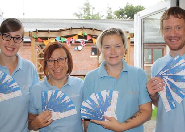 Rainbows Hospice care team members Michelle Oldfield, Wendy Kaye, Gemma McLoughlin and Julian Fletcher with the Big Christmas Raffle tickets.