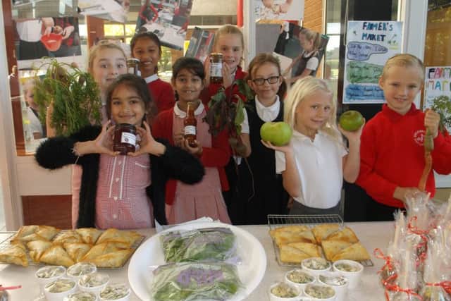 Enthusiastic young growers show off their food products at the school farmers market PHOTO: Supplied