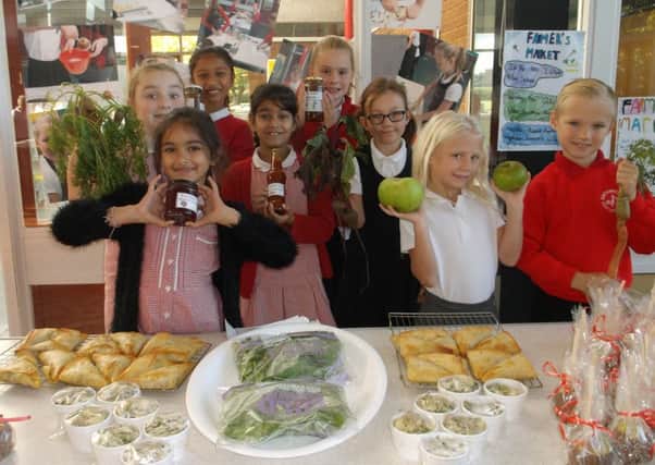 Enthusiastic young growers show off their food products at the school farmers market PHOTO: Supplied