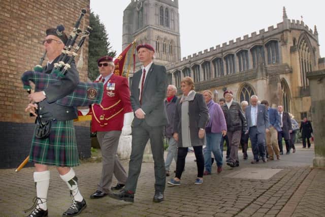 The piper leads away the parade from St.Mary's Church, Melton, to mark the 75th anniversary of the formation of 156 Battalion, the Parachute Regiment EMN-161018-111043001