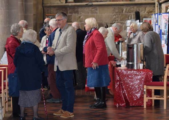 Interested churchgoers deep in coversation about the Re-ordering Project PHOTO: Supplied