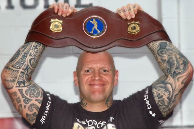 Butlin with the Midlands heavyweight belt in 2014 EMN-161025-134355002