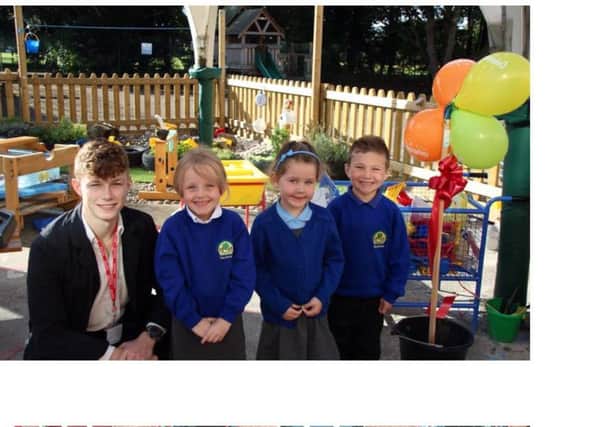 Tom with pupils at Grove Primary School