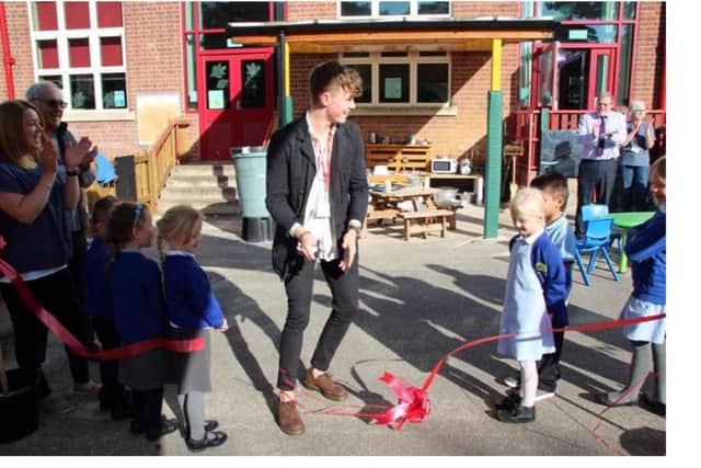 Tom with pupils at Grove Primary School