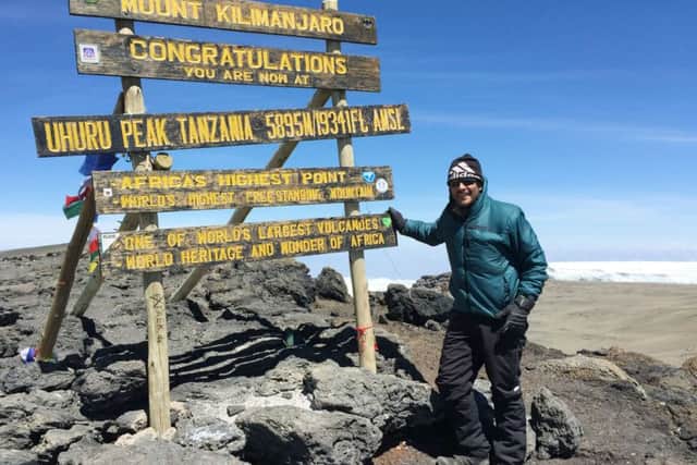 Melton man Jason Hall at the summit of Mount Kilimanjaro after completing the climb in aid of the Georgie's Gift charity EMN-160111-153931001