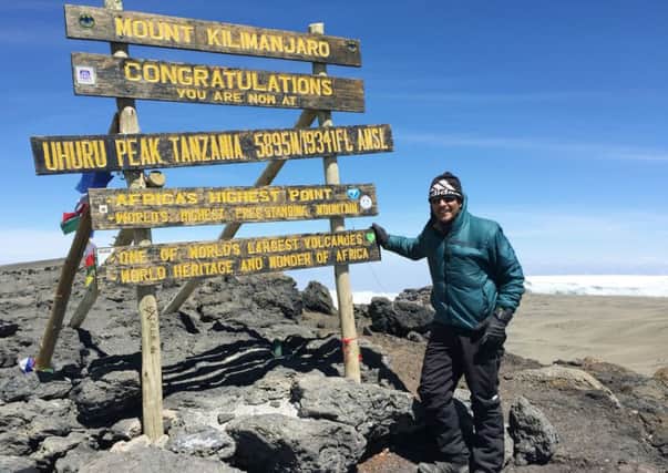Melton man Jason Hall at the summit of Mount Kilimanjaro after completing the climb in aid of the Georgie's Gift charity EMN-160111-153931001