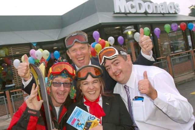 Eddie 'The Eagle' Edwards, with franchisee Martin Cuthbert and members of staff, reopens Melton's McDonald's restaurant EMN-160111-174202001