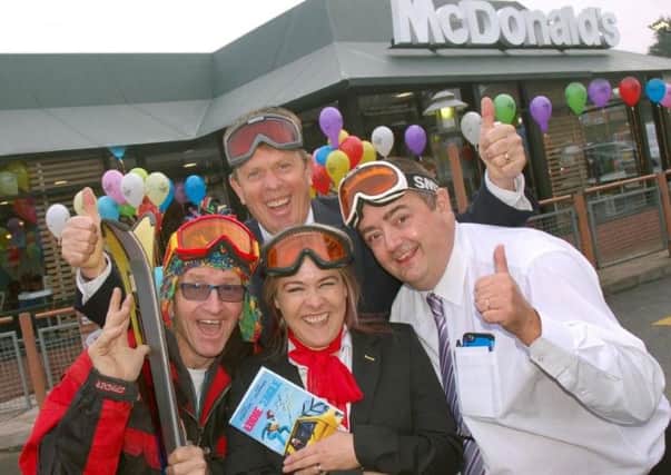 Eddie 'The Eagle' Edwards, with franchisee Martin Cuthbert and members of staff, reopens Melton's McDonald's restaurant EMN-160111-174202001