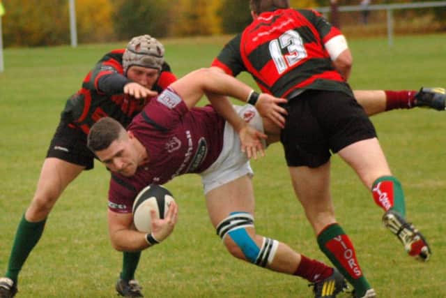 Leon Gormley gets up-ended by the Paviors defence EMN-160111-085825002