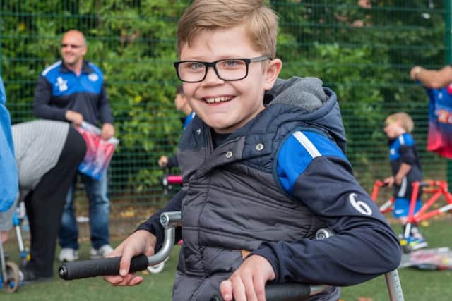 Melton 10-year-old Luke Campey, who has cerebral palsy, uses his new Crocodile walking frame to help him play football EMN-161116-124604001