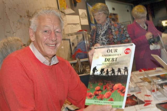 Derek Simmonds shows off his new book, Our Unforgotten Debt', which recognises the deeds and sacrifices of the Melton Mowbray and District Territorials 1914-1918 EMN-161116-154405001